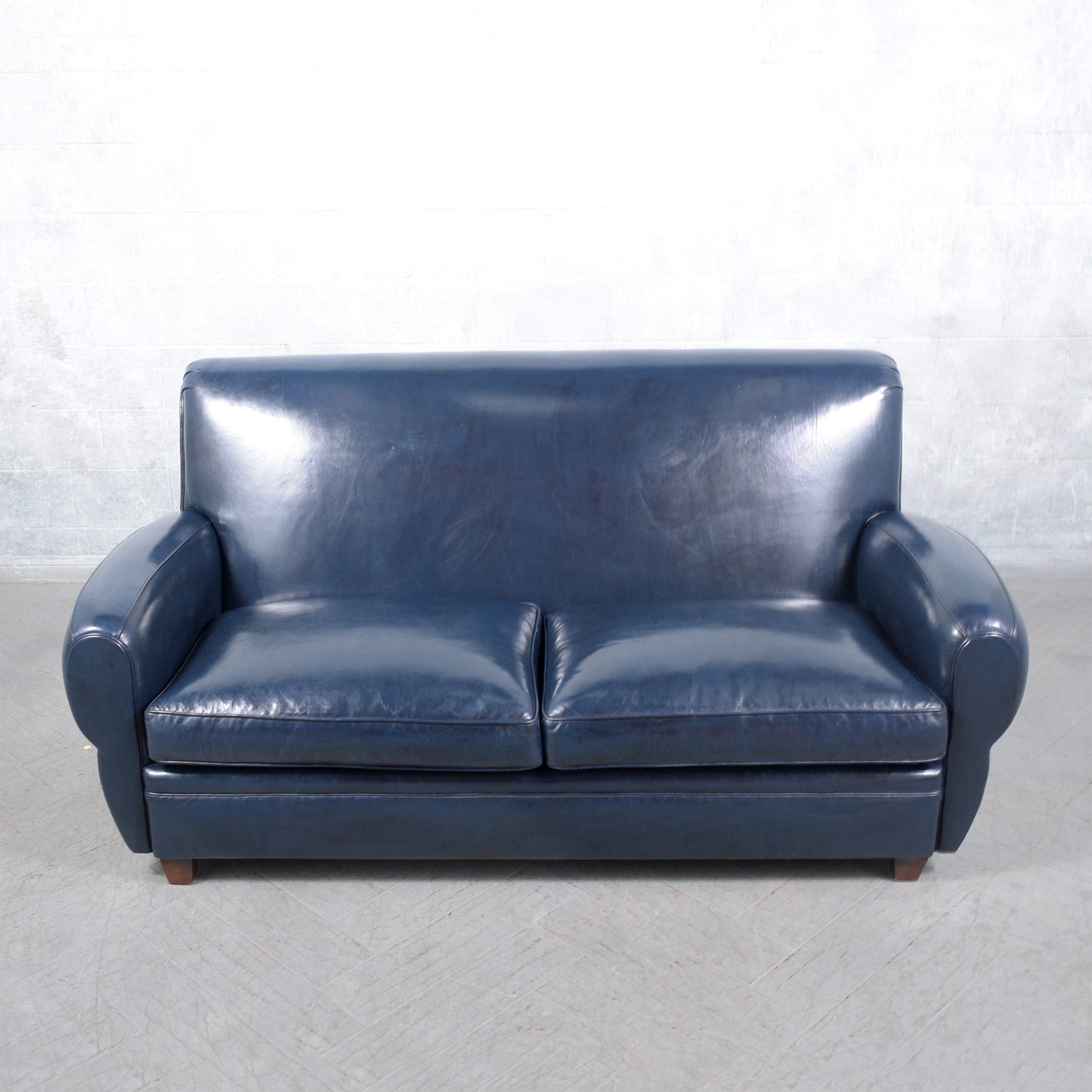 1970s Art Deco Sofa Restoration: Timeless Elegance in Navy Blue Leather