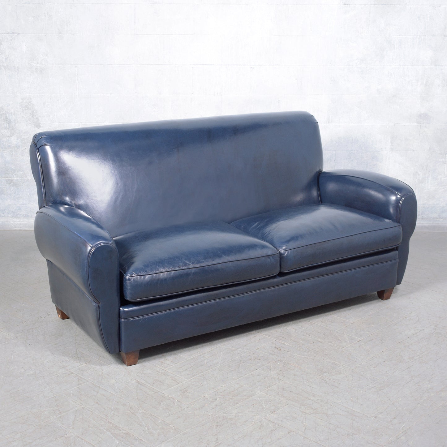 1970s Art Deco Sofa Restoration: Timeless Elegance in Navy Blue Leather