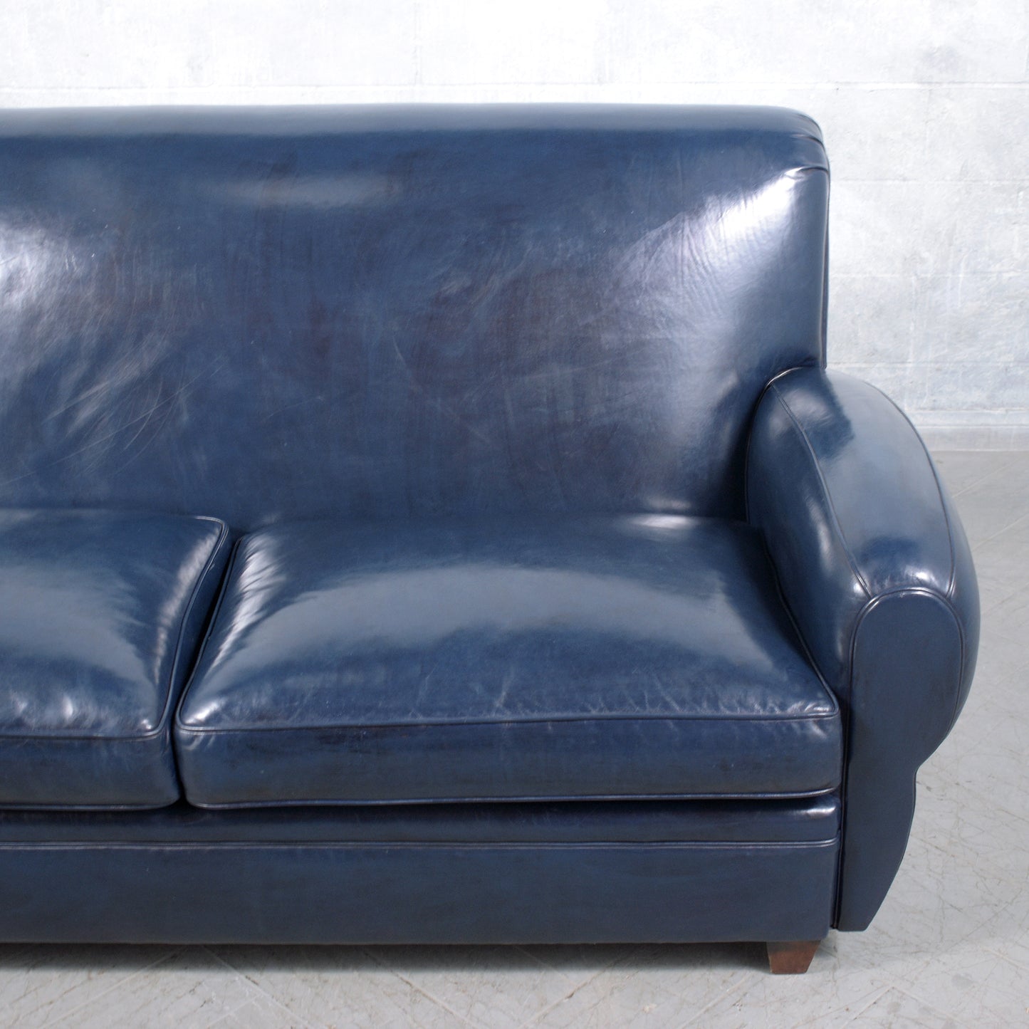 1970s Art Deco Sofa Restoration: Timeless Elegance in Navy Blue Leather