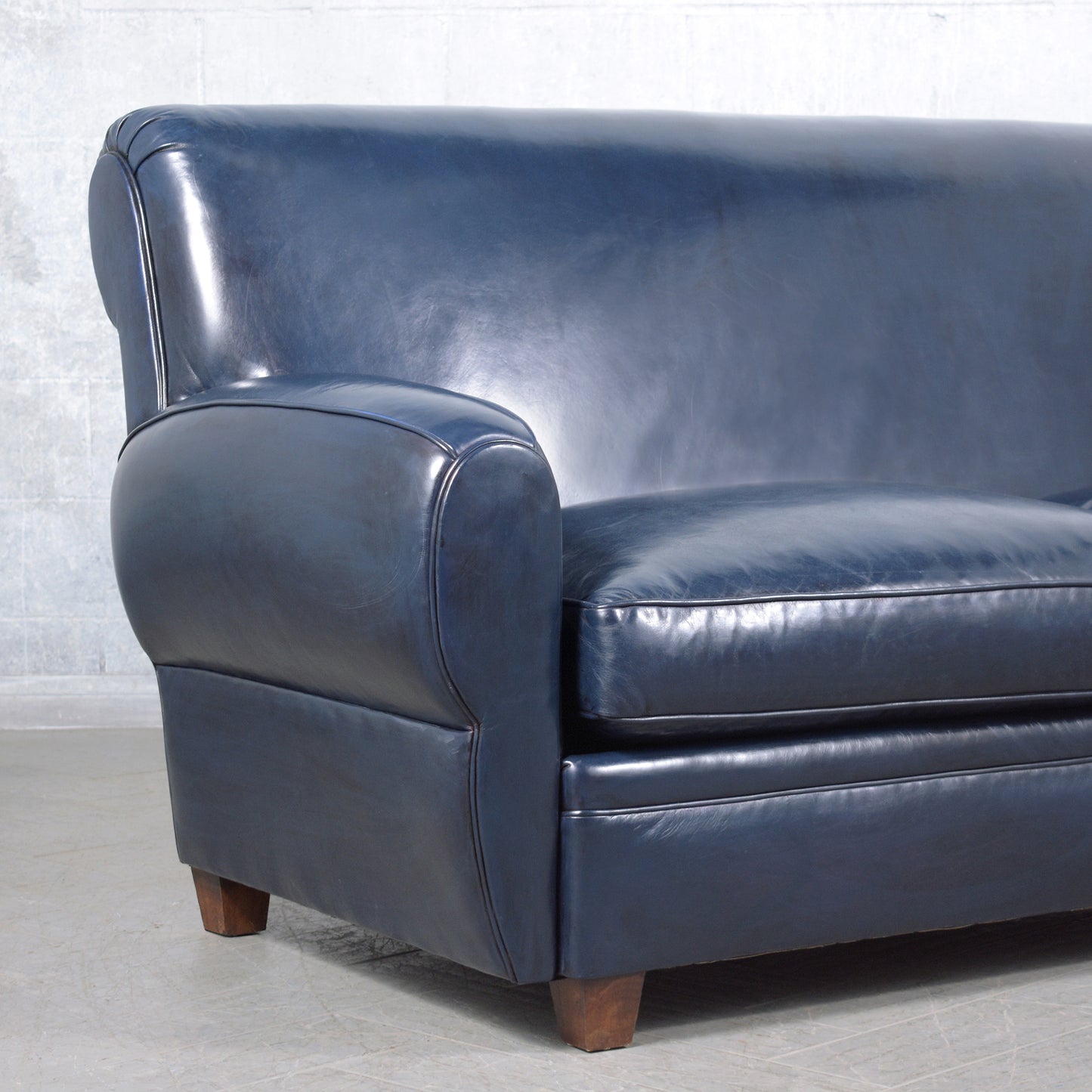 1970s Art Deco Sofa Restoration: Timeless Elegance in Navy Blue Leather