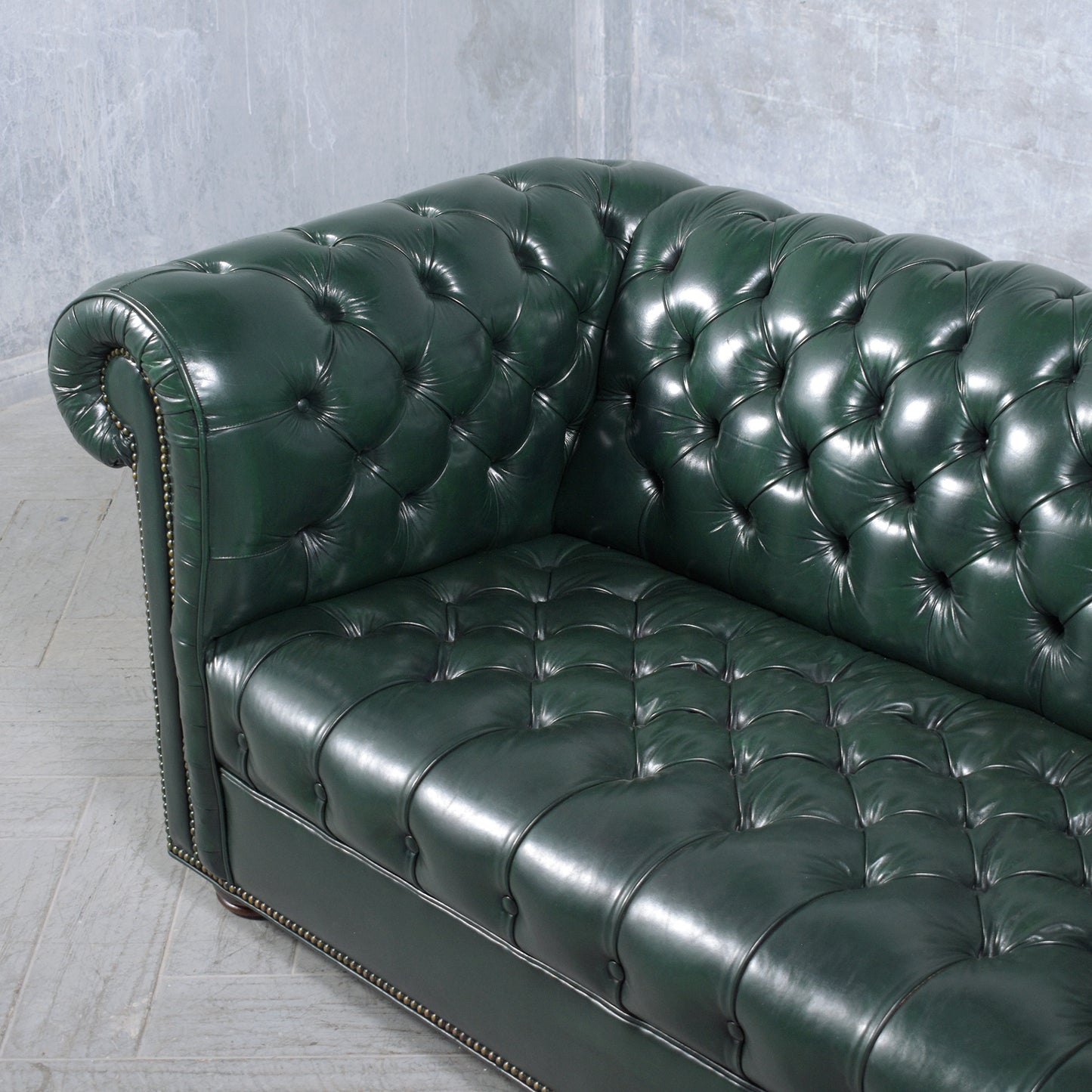 1970s Vintage Chesterfield Sofa: Emerald Green Leather with Elegant Carved Legs