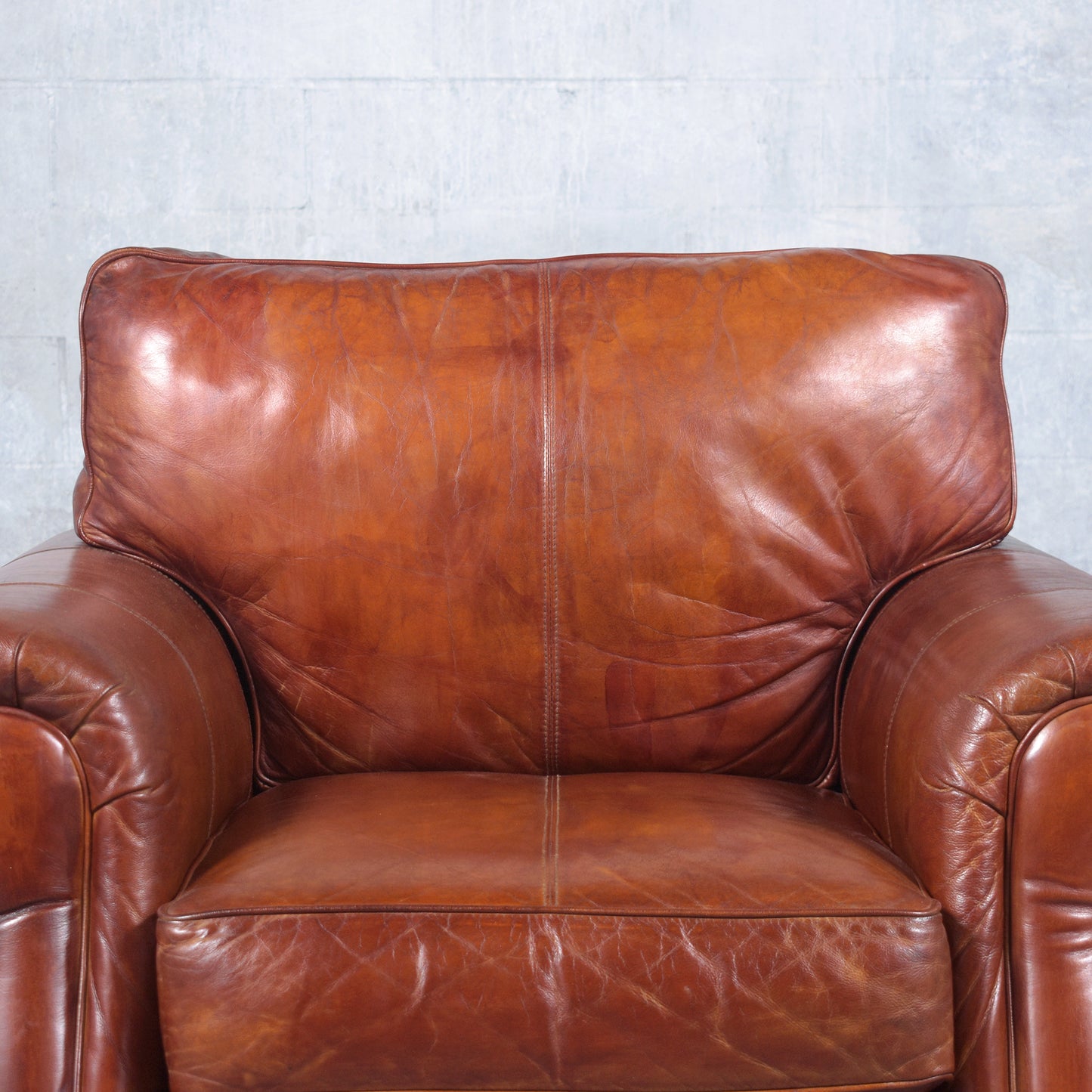 Restored Vintage Leather Armchairs: Rich Cognac Brown Elegance